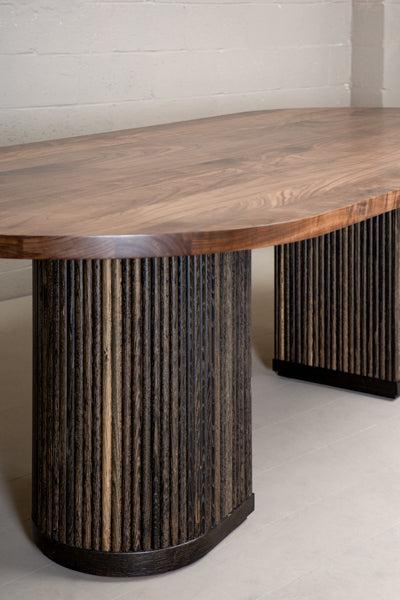 double pedestal dining table with fluted base