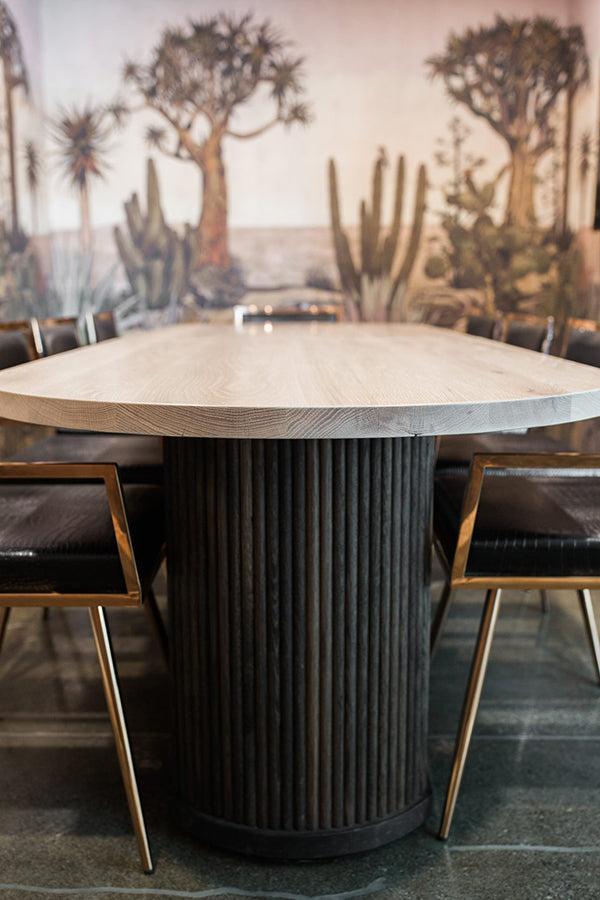 Long pedestal dining table